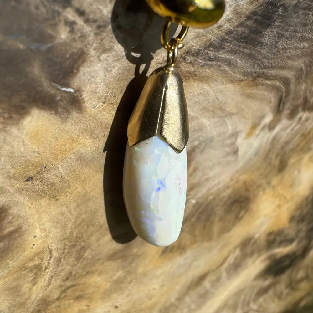 Gold-capped opal pendant from Golden Horizons, handcrafted 9ct solid gold with lightning ridge white opal