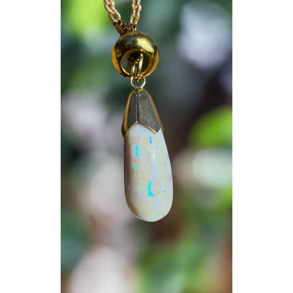 Teardrop Lightning Ridge White Opal pendant with 9ct solid gold accents from Golden Horizons