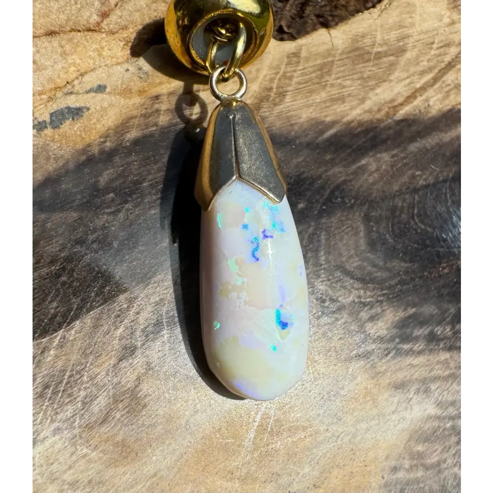 Golden Horizons handcrafted 9ct gold lightning ridge white opal pendant with gold accents