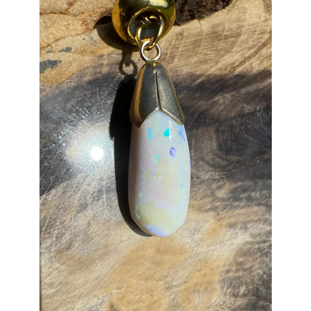 Golden Horizons handcrafted 9ct gold lightning ridge white opal pendant with gold accents
