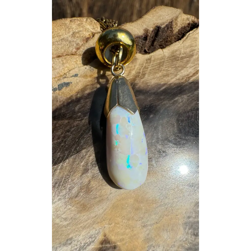 Gold and opal pendant from Golden Horizons featuring a handcrafted 9ct solid gold Lightning Ridge white opal