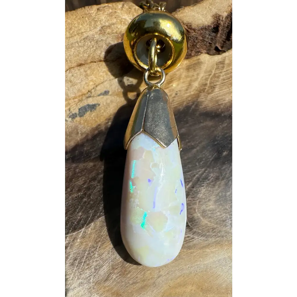 Teardrop Lightning Ridge White Opal pendant with gold accents from Golden Horizons collection