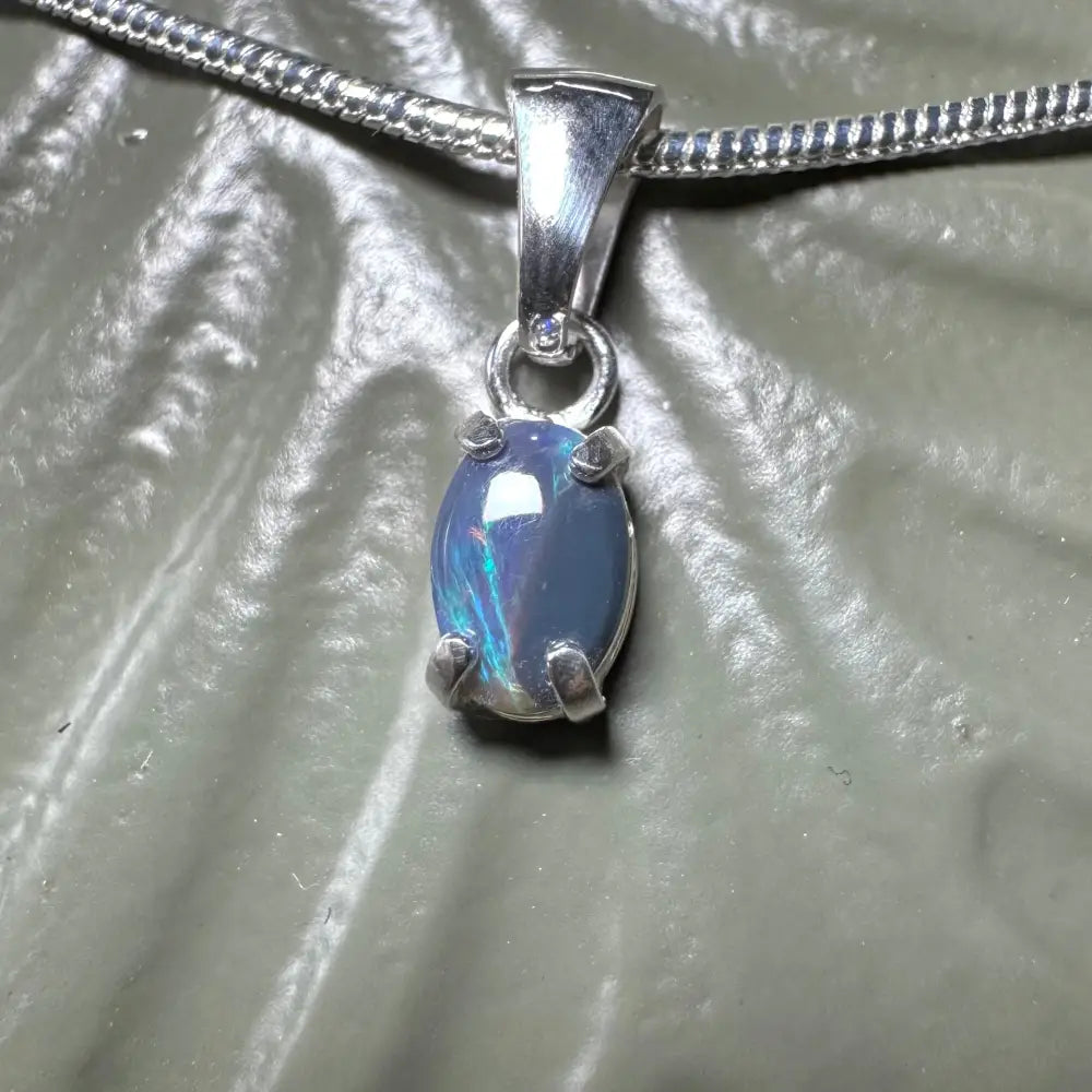 Silver opal pendant necklace featuring a handcrafted 0.6ct Lightning Ridge Opal in sterling silver