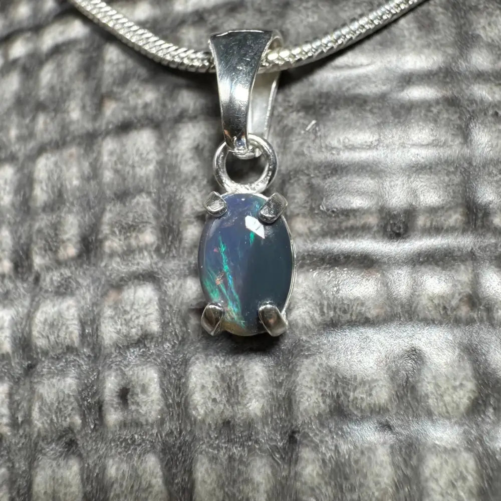 Silver opal pendant necklace featuring a handcrafted 0.6ct Lightning Ridge Opal in sterling silver