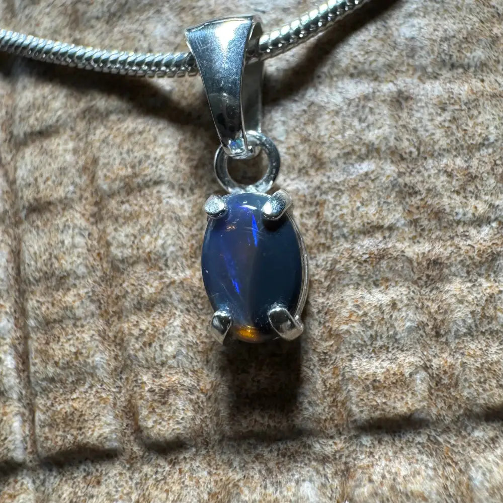Silver pendant featuring dark opal from Lightning Ridge in a handcrafted sterling silver setting