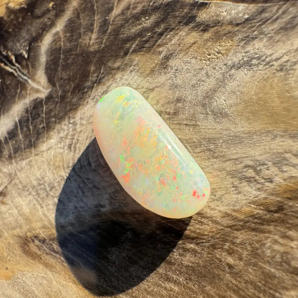 Iridescent Coober Pedy opal cabochon in a hand-cut 2.9-carat setting