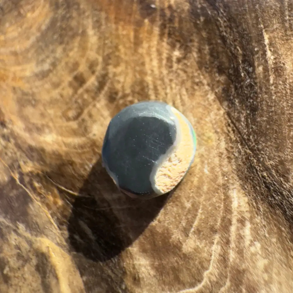 Two-toned rounded stone from Hand-Cut Solid Lightning Ridge Black Opal 0.9 carats