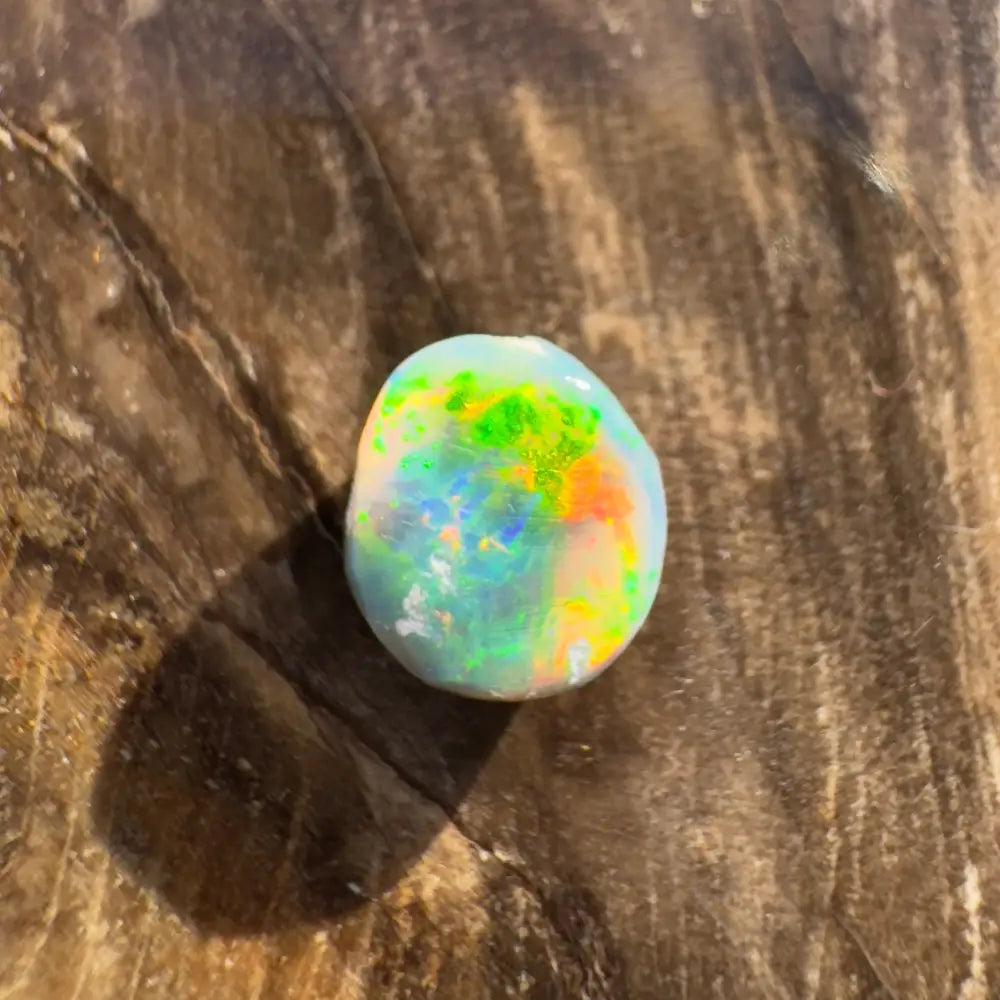 Iridescent opal gemstone from Hand-Cut Solid Lightning Ridge Black Opal 0.9 carat