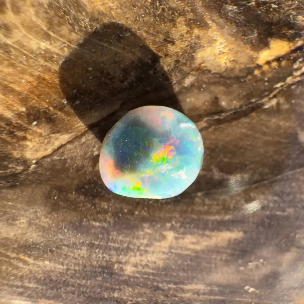 Iridescent opal gemstone from Lightning Ridge in a 0.9 carat hand-cut black opal