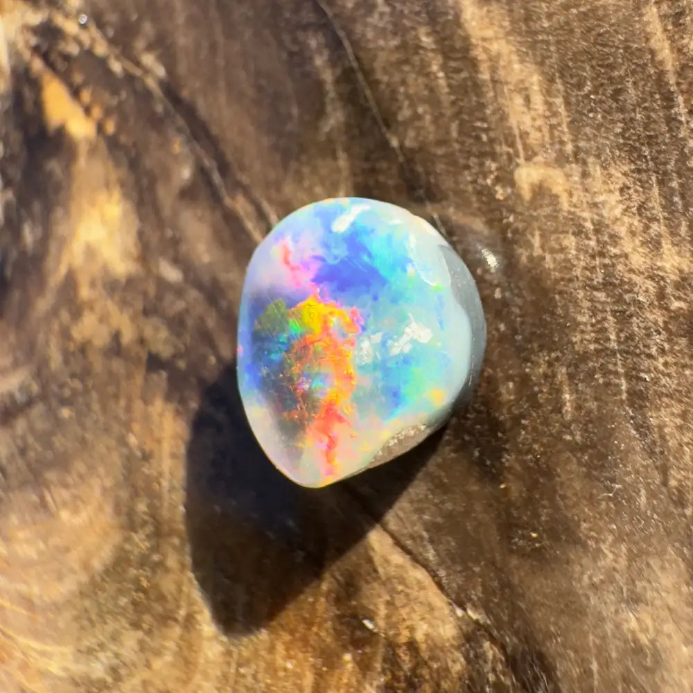 Iridescent opal gemstone from Hand-Cut Solid Lightning Ridge Black Opal 0.9 carat product