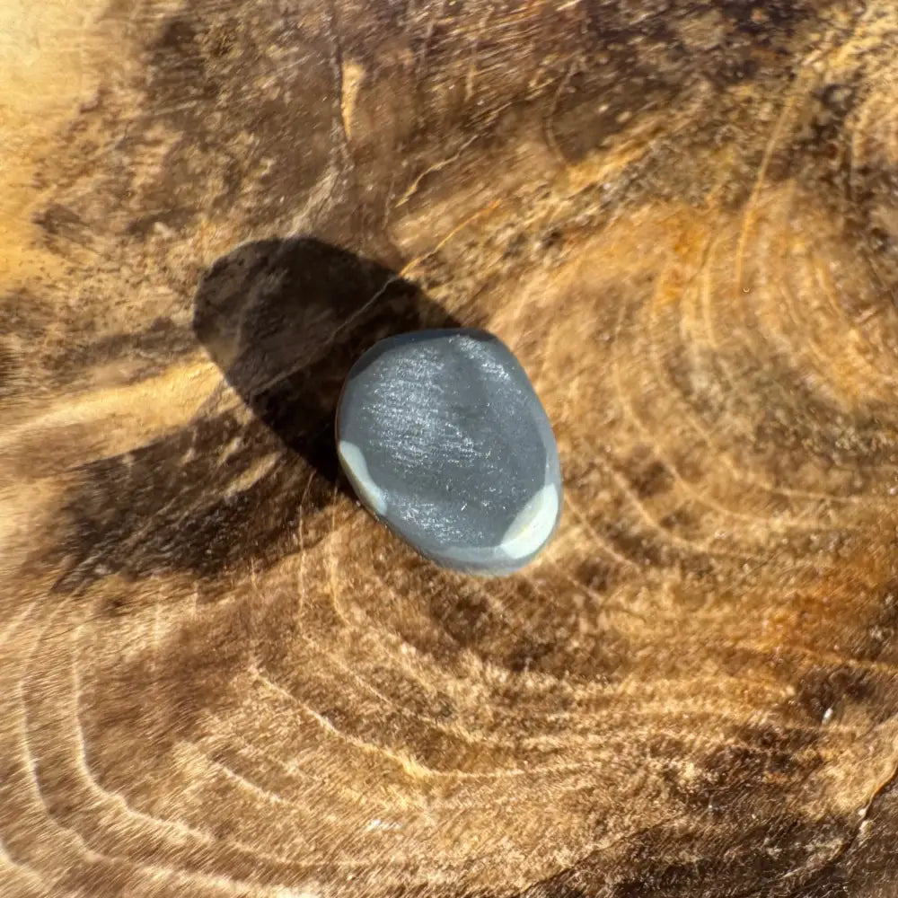Smooth gray stone with white markings from Hand-Cut Solid Lightning Ridge Black Opal 0.9carat