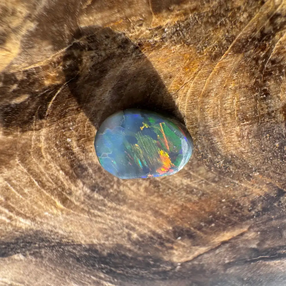 Iridescent opal cabochon from Hand-Cut Solid Lightning Ridge Black Opal 0.9carat