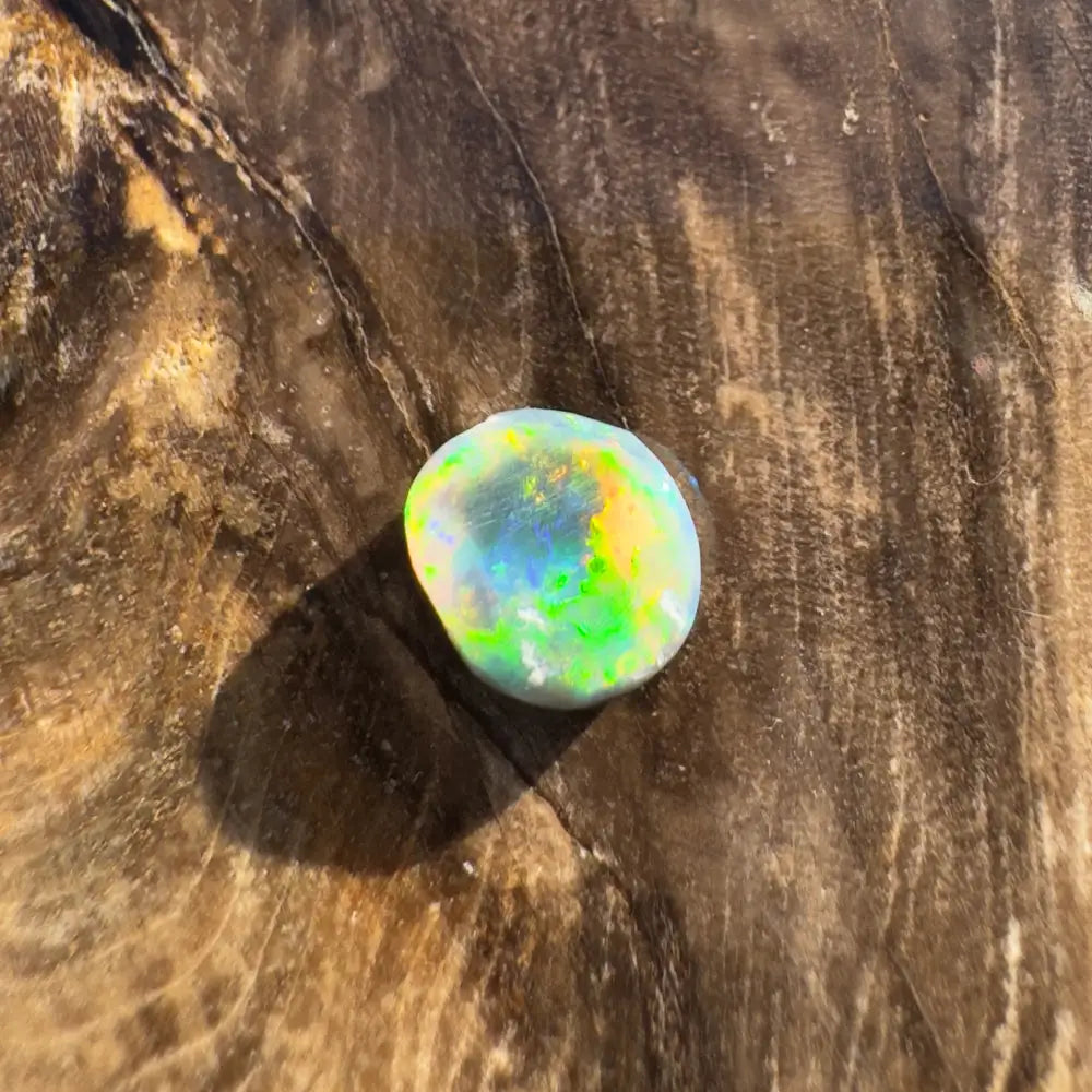 Iridescent opal cabochon from Hand-Cut Solid Lightning Ridge Black Opal 0.9 carat