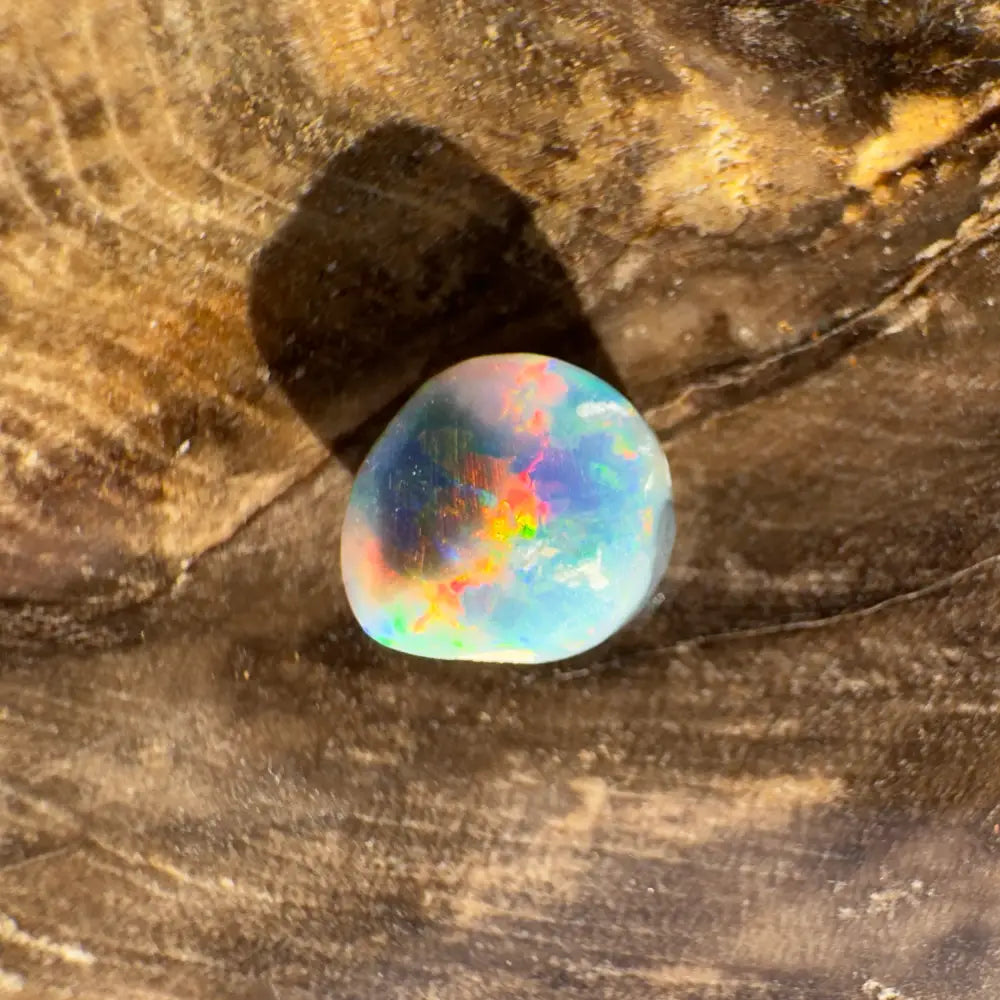 Iridescent opal gemstone from Hand-Cut Solid Lightning Ridge Black Opal 0.9 carat