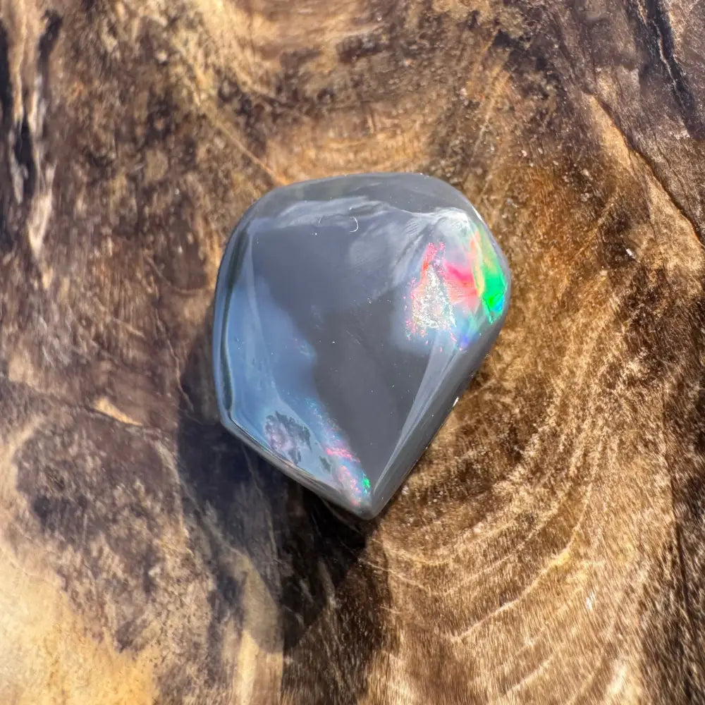 Polished gray opal with iridescent flashes from Hand-Cut Solid Lightning Ridge Black Opal 4.0carat