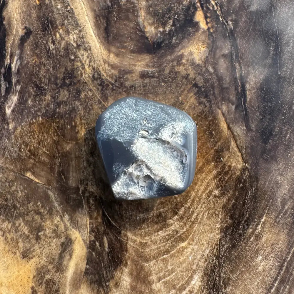 Polished gray stone with white inclusions from Hand-Cut Solid Lightning Ridge Black Opal 4.0 carats
