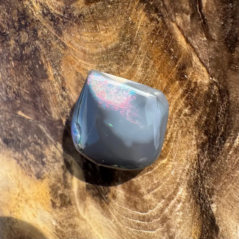 Polished gray Lightning Ridge Black Opal with iridescent shimmer in a 4.0 carat hand-cut specimen