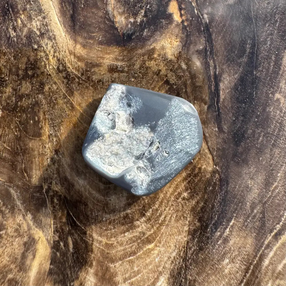 Polished gray stone with white inclusions from Hand-Cut Solid Lightning Ridge Black Opal 4.0 carat