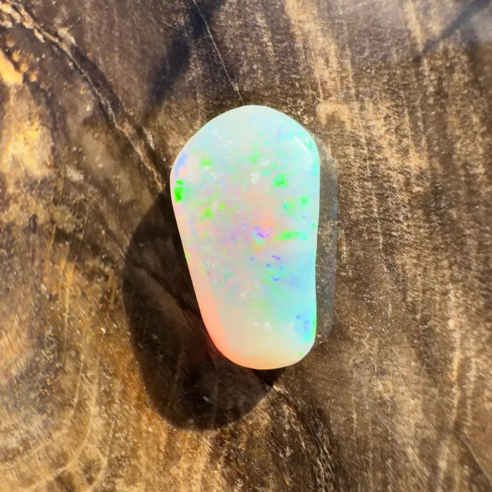 Iridescent Lightning Ridge Crystal Opal gemstone in a handcrafted 1.0 carat setting