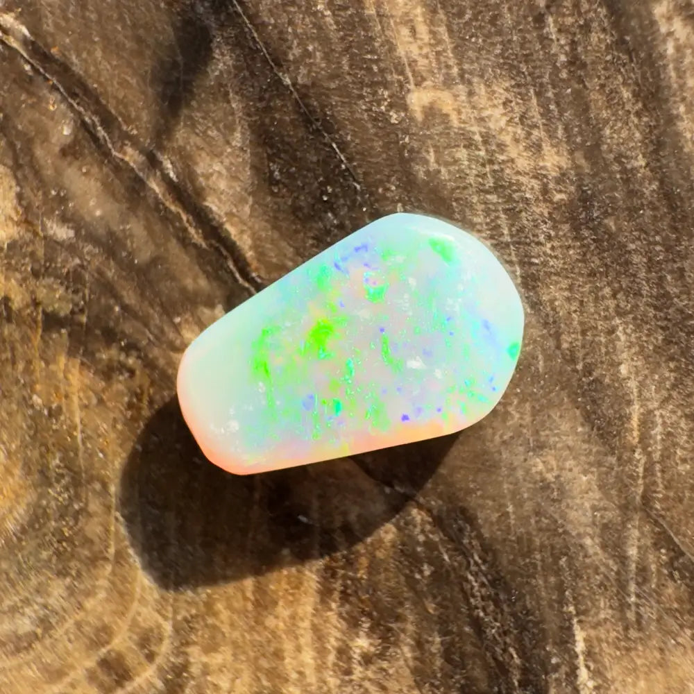 Iridescent Opal gemstone from Lightning Ridge in a 1.0 carat hand-cut crystal display