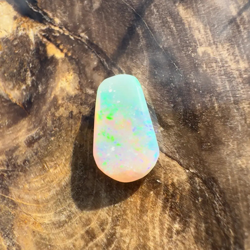 Iridescent Lightning Ridge Crystal Opal gemstone in a 1.0 carat hand-cut solid piece