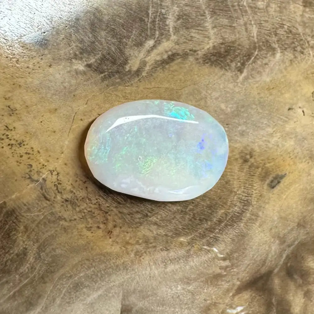 Iridescent opal gemstone displayed on Hand-Cut Solid Lightning Ridge Opal 1.2carat product