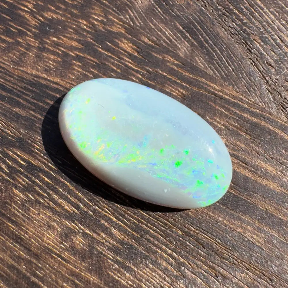 Oval opal gemstone with iridescent colors from Hand-Cut Solid Lightning Ridge Opal 11.6 carats