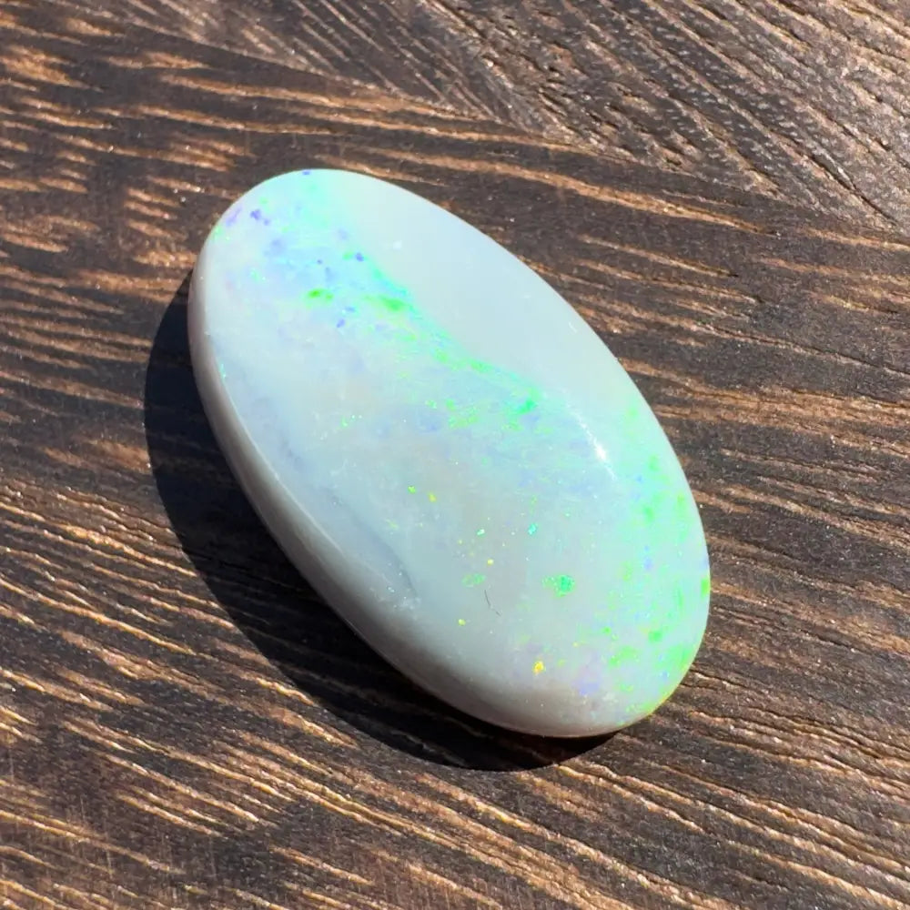 Oval opal cabochon with iridescent play-of-color in Hand-Cut Solid Lightning Ridge Opal 11.6carat