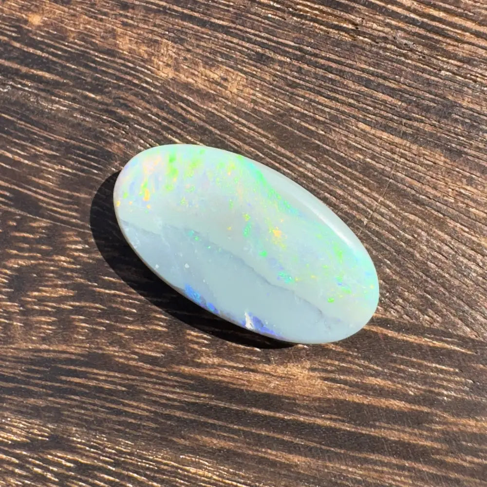 Hand-cut Solid Lightning Ridge Opal 11.6carat with iridescent oval gemstone display