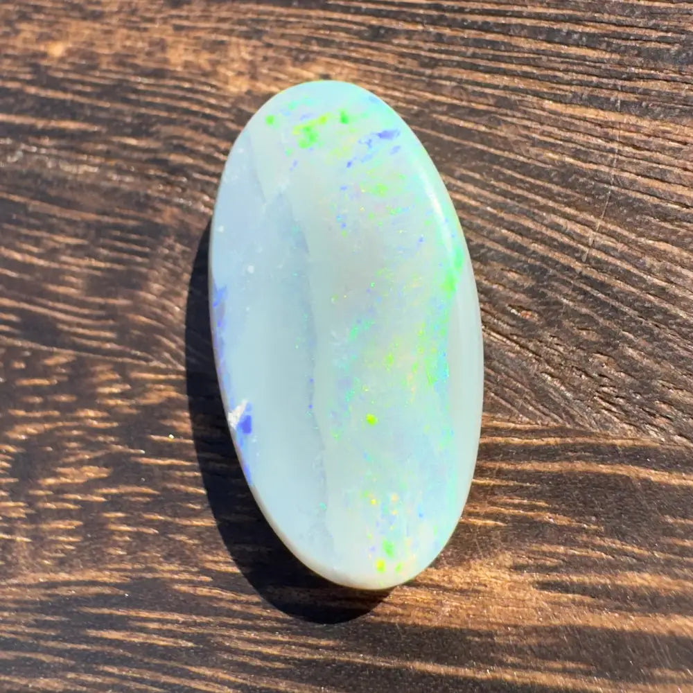 Oval opal gemstone with colorful specks from Hand-Cut Solid Lightning Ridge Opal 11.6carat