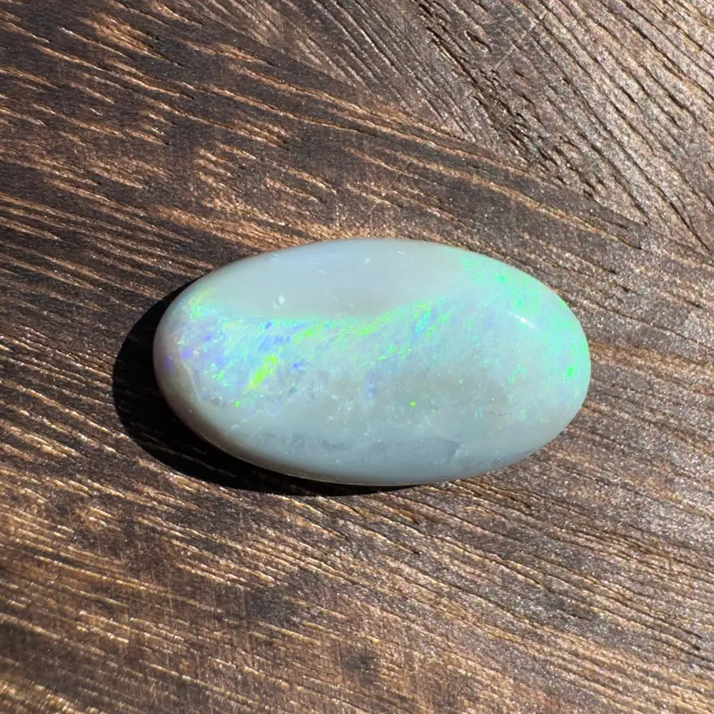 Oval Lightning Ridge opal gemstone with iridescent play-of-color for the Hand-Cut Solid Opal 11.6 carats