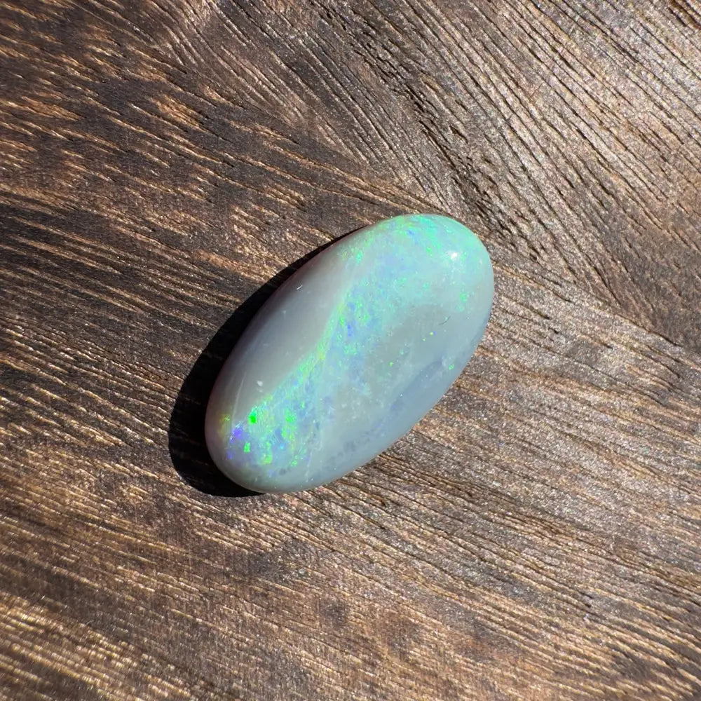 Iridescent oval opal from Lightning Ridge in the Hand-Cut Solid Opal 11.6 carat jewelry piece