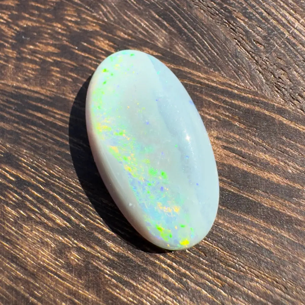 Oval opal gemstone with iridescent colors from Hand-Cut Solid Lightning Ridge Opal 11.6carat