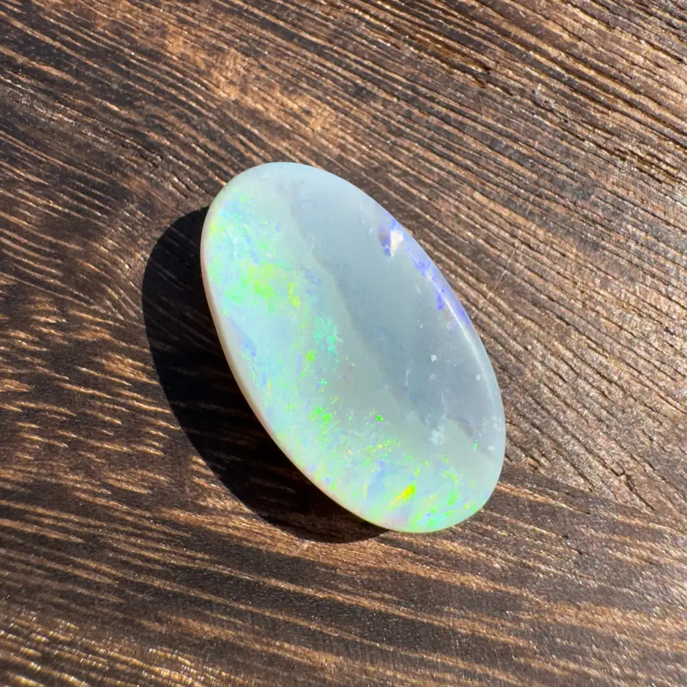 Oval Lightning Ridge Opal gemstone with iridescent colors for the Hand-Cut 11.6carat product