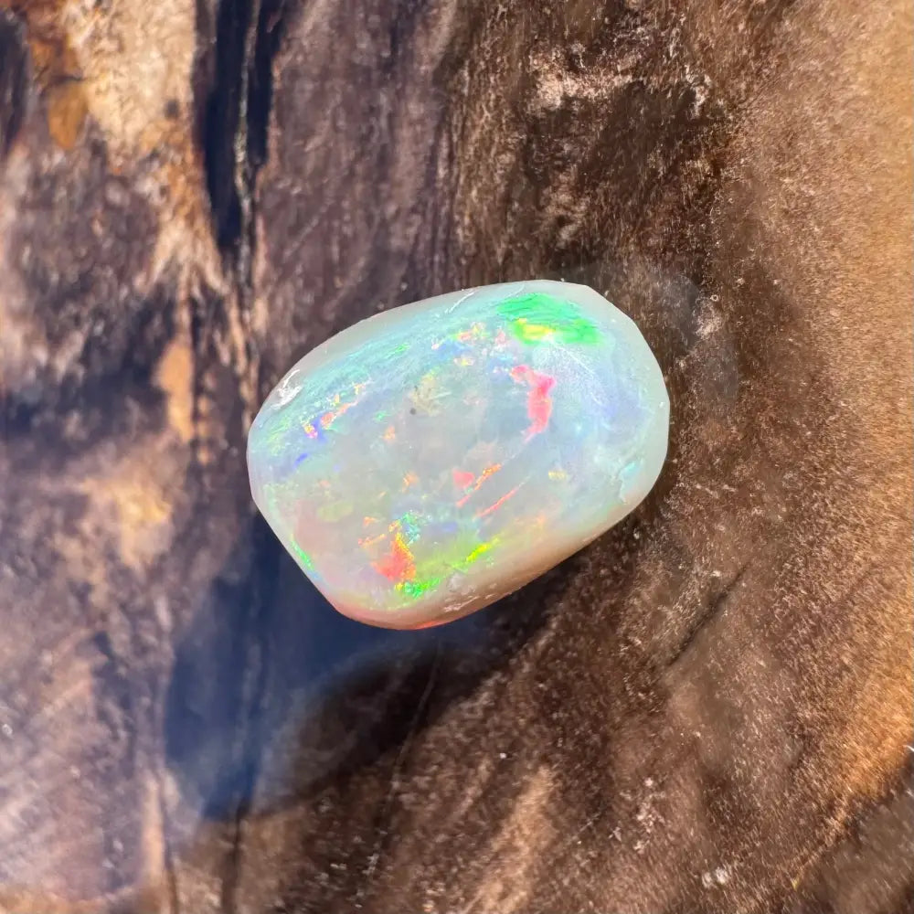 Iridescent opal gemstone in a hand-cut Lightning Ridge Opal weighing 2.4 carats