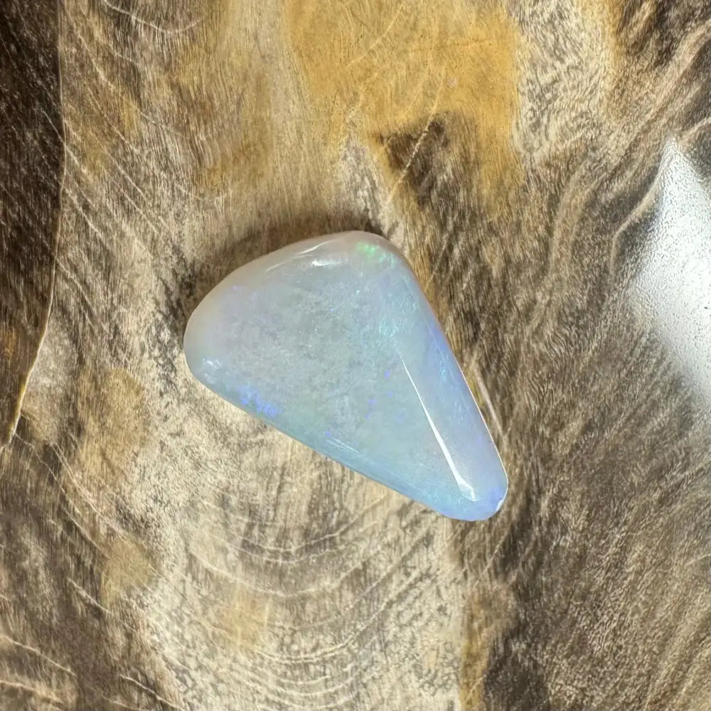 Iridescent polished Lightning Ridge opal cabochon in a 4.1carat hand-cut solid gemstone