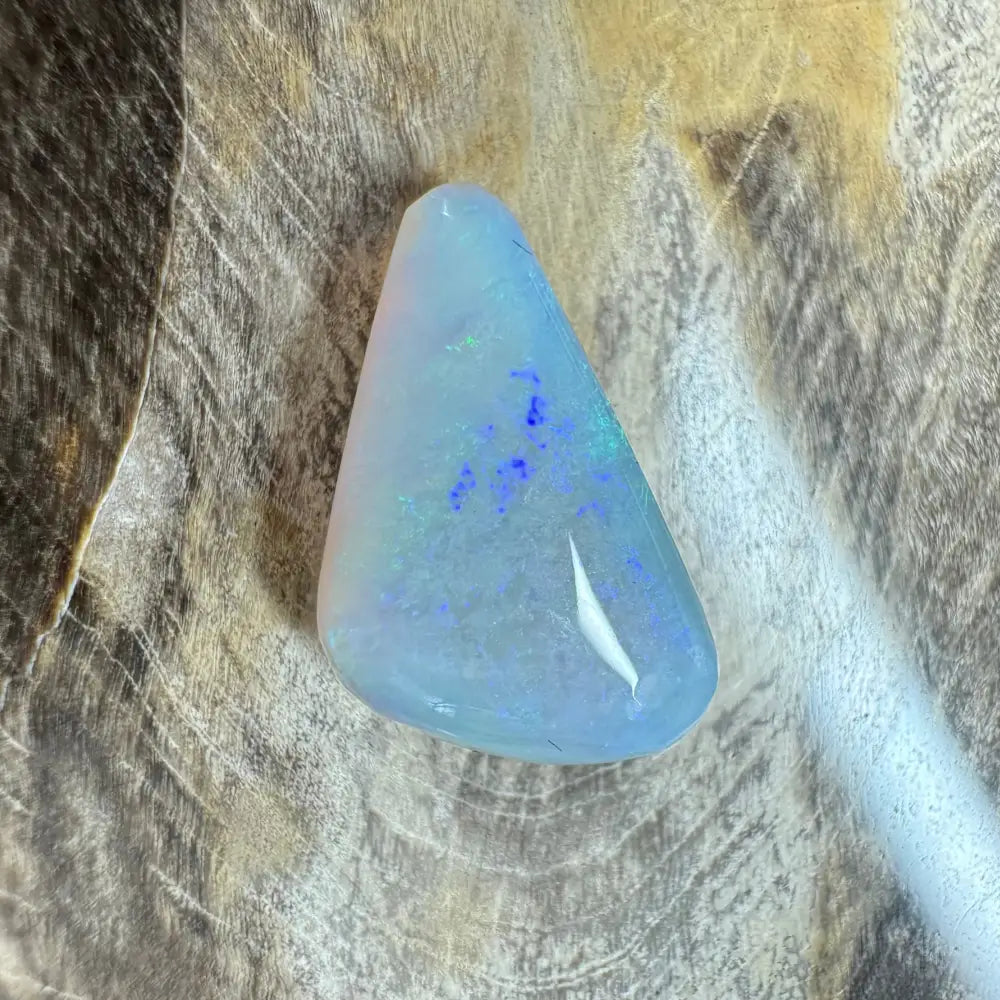 Iridescent triangular Lightning Ridge opal cabochon from the Hand-Cut Solid Opal 4.1 carat product