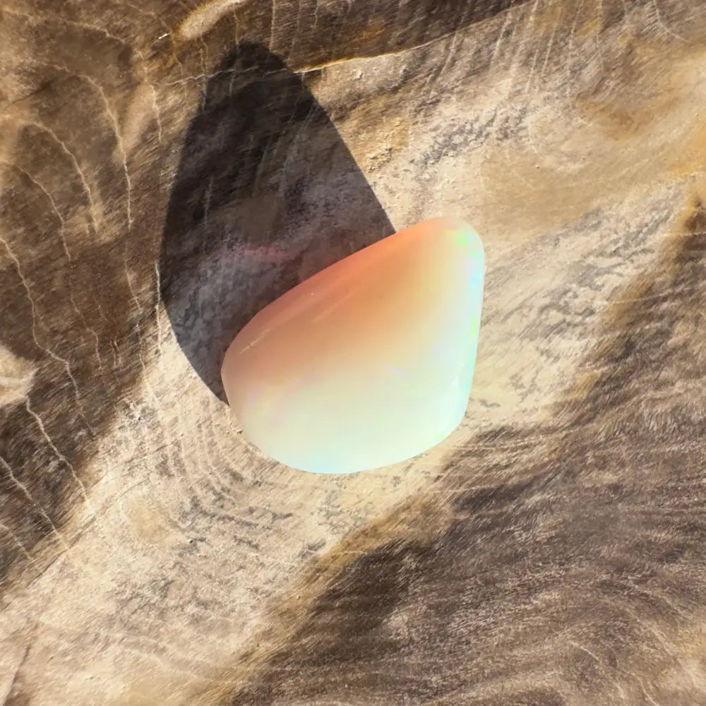 Hand-cut Lightning Ridge Opal 4.1 carats featuring a smooth, translucent teardrop-shaped stone
