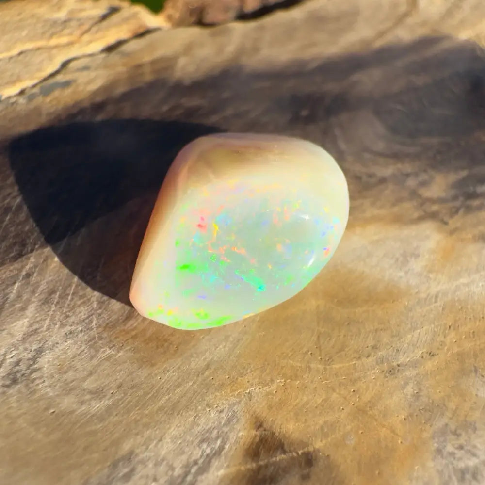 Polished Lightning Ridge Opal with iridescent colors in a 4.1 carat hand-cut gemstone