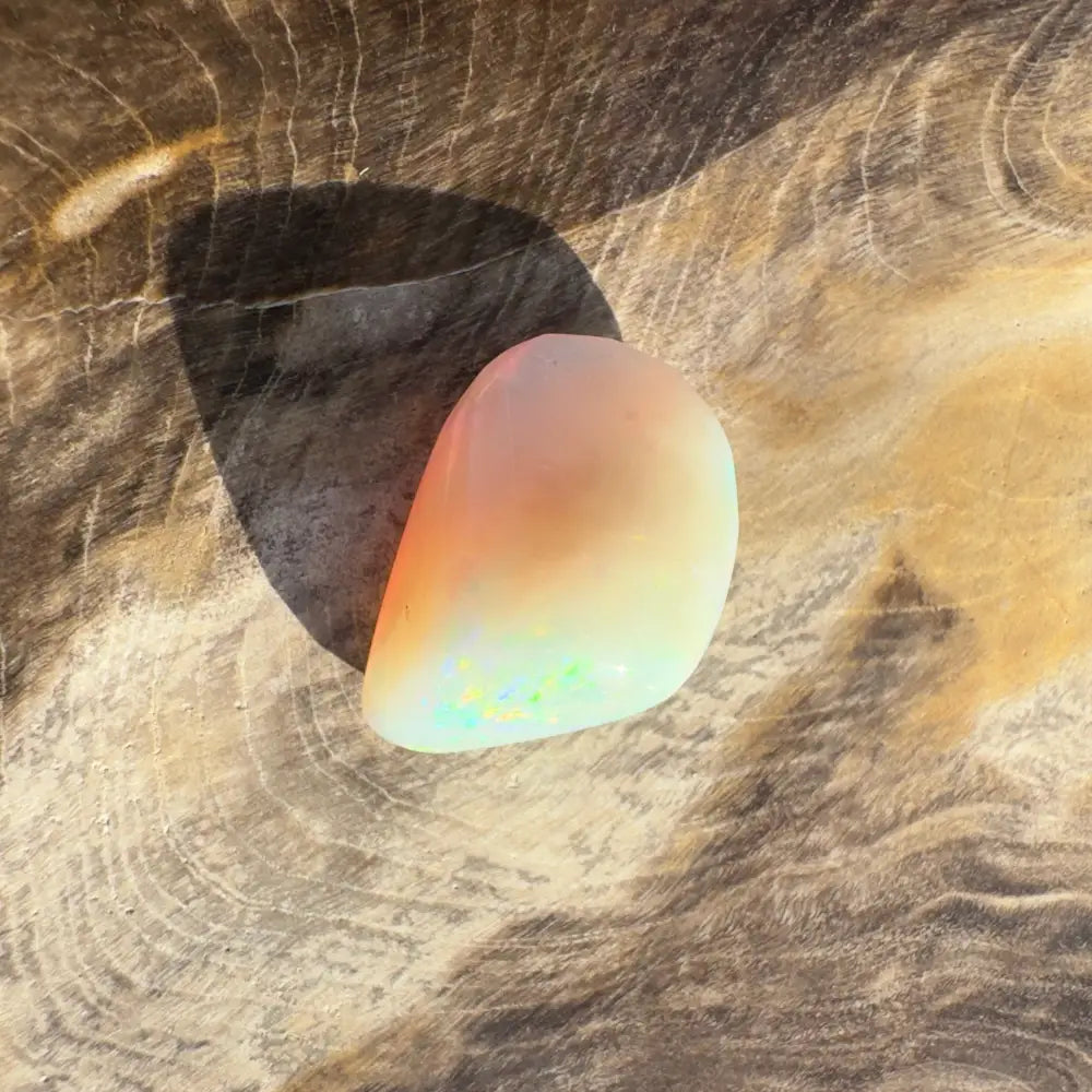 Iridescent Opal gemstone from Lightning Ridge in a 4.1-carat hand-cut solid setting