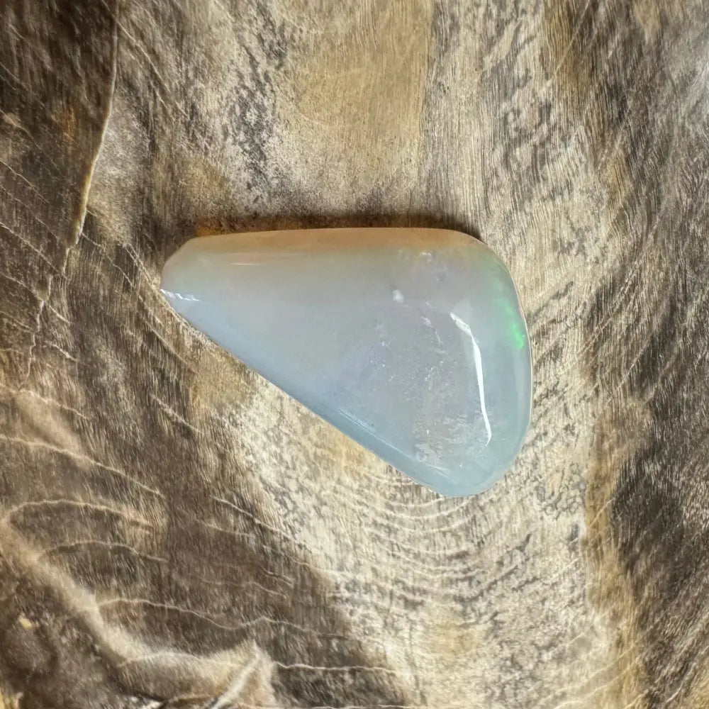 Iridescent triangular Lightning Ridge Opal gemstone for jewelry