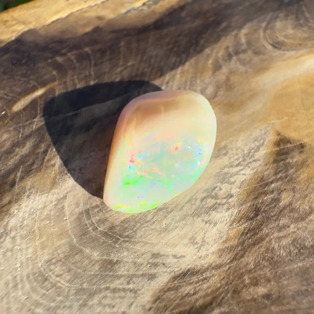 Hand-Cut Solid Lightning Ridge Opal 4.1 Carat showcasing iridescent opal gemstone