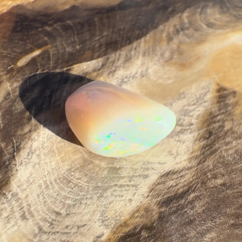Polished Lightning Ridge Opal gemstone with iridescent flashes for elegant jewelry display