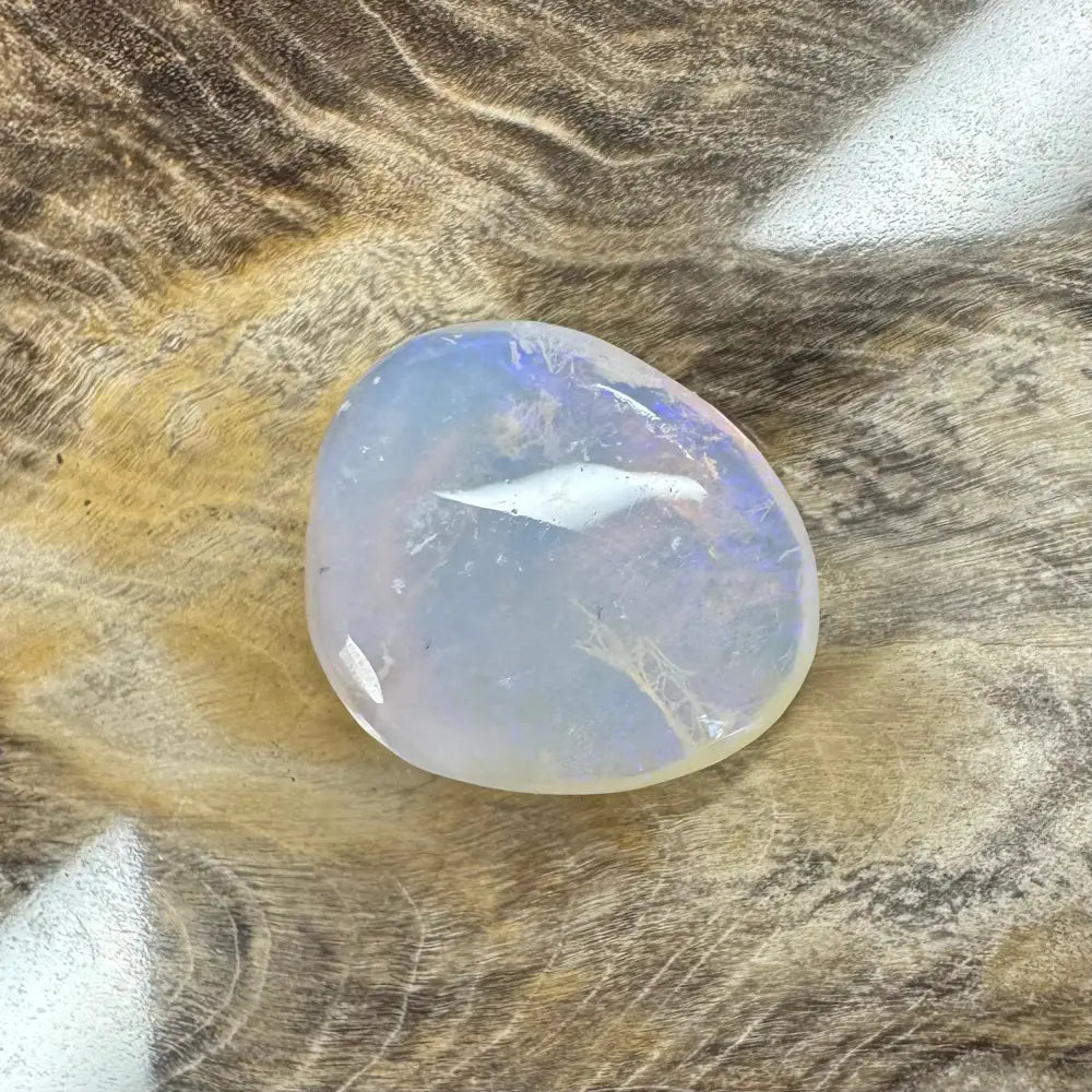 Translucent iridescent polished Lightning Ridge Opal showcasing vibrant play of colors