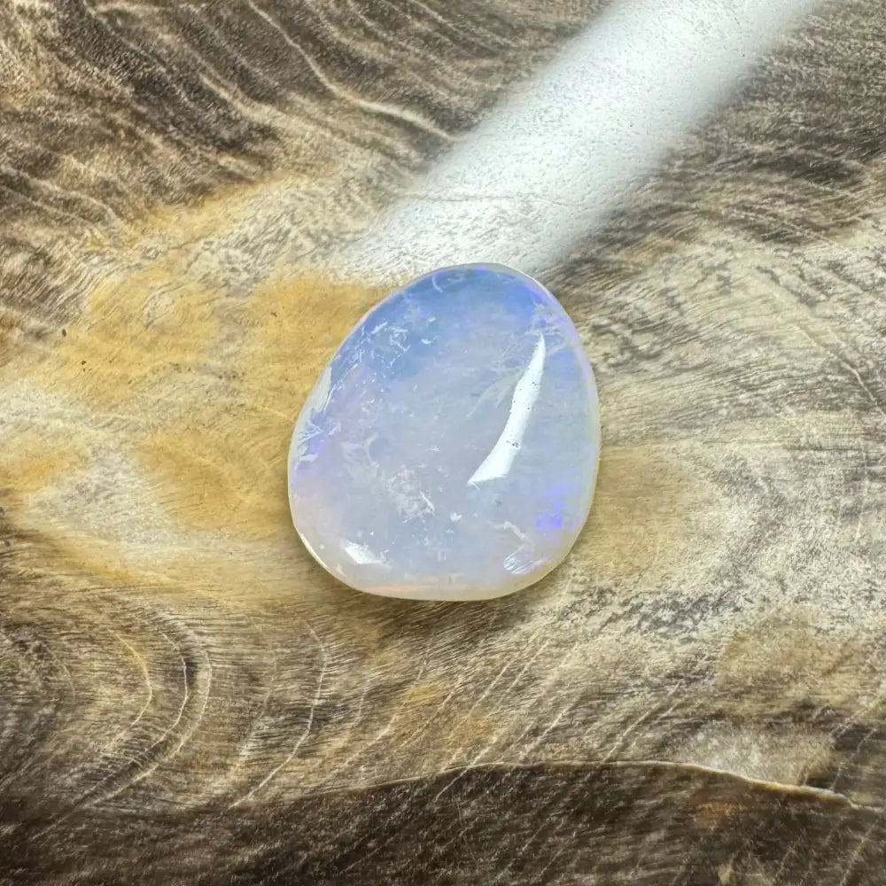 Translucent iridescent gemstone in a Hand-Cut Solid Lightning Ridge Opal 4.7 carat