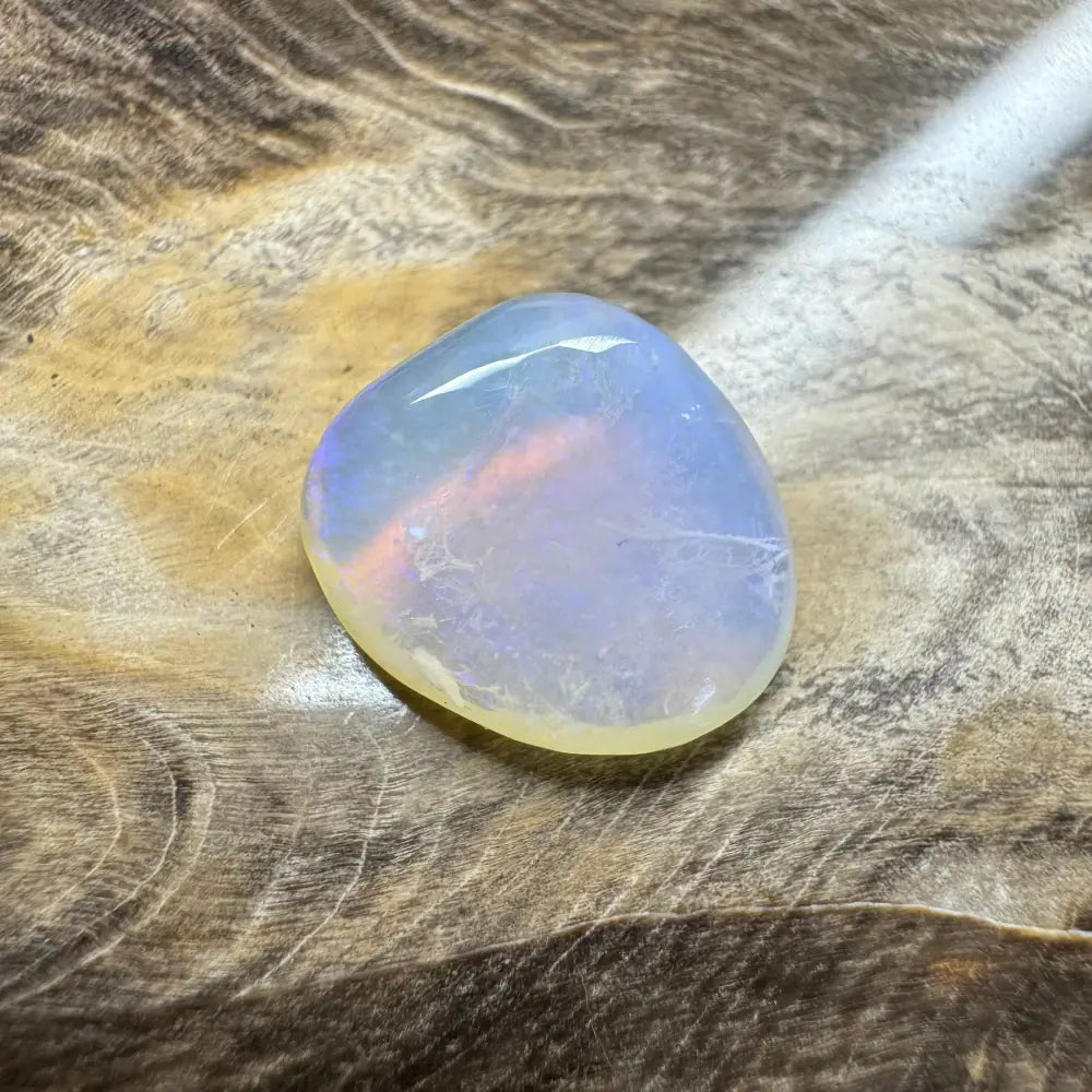 Translucent iridescent polished Lightning Ridge Opal 4.7 carats displayed in a product image