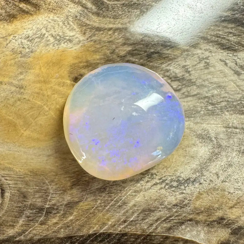 Translucent Lightning Ridge Opal with blue and purple flashes in a 4.7 carat hand-cut gemstone