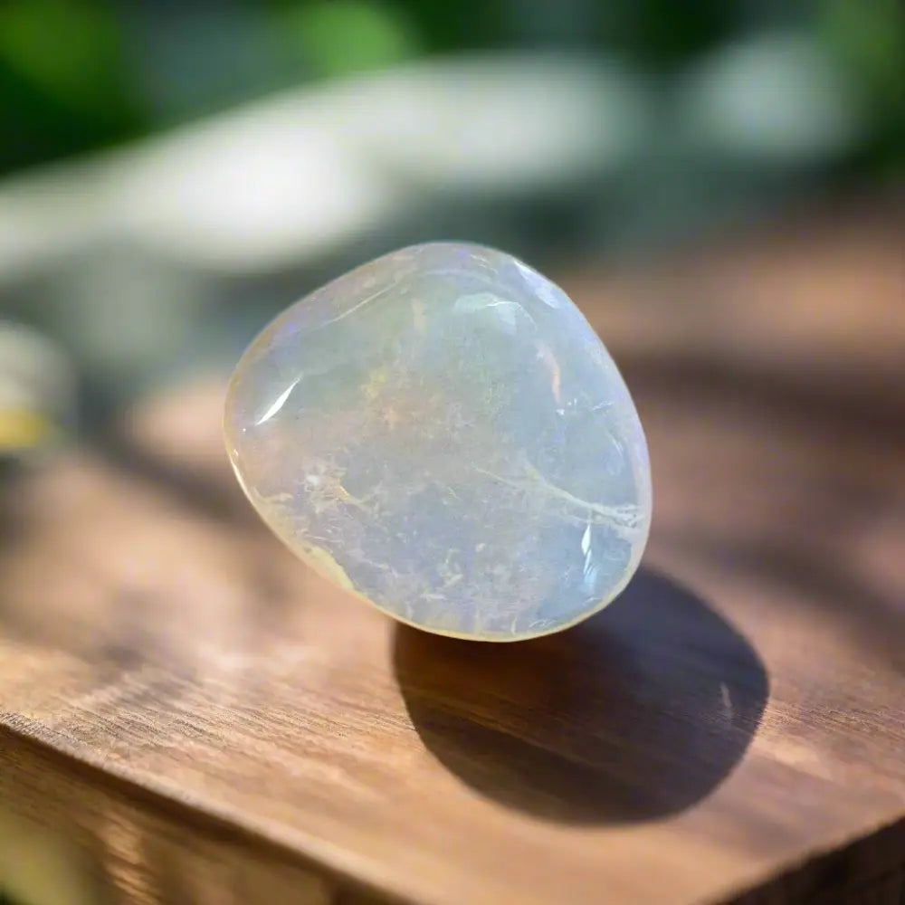 Polished translucent iridescent Lightning Ridge Opal showing vibrant color play in the 4.7carat handcrafted piece