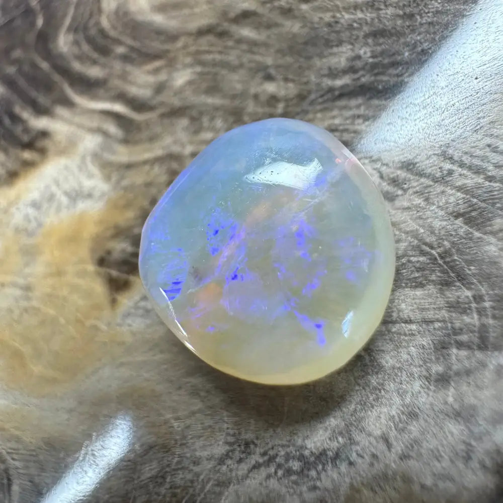 Iridescent opal gemstone in a Hand-Cut Solid Lightning Ridge Opal 4.7 carats display