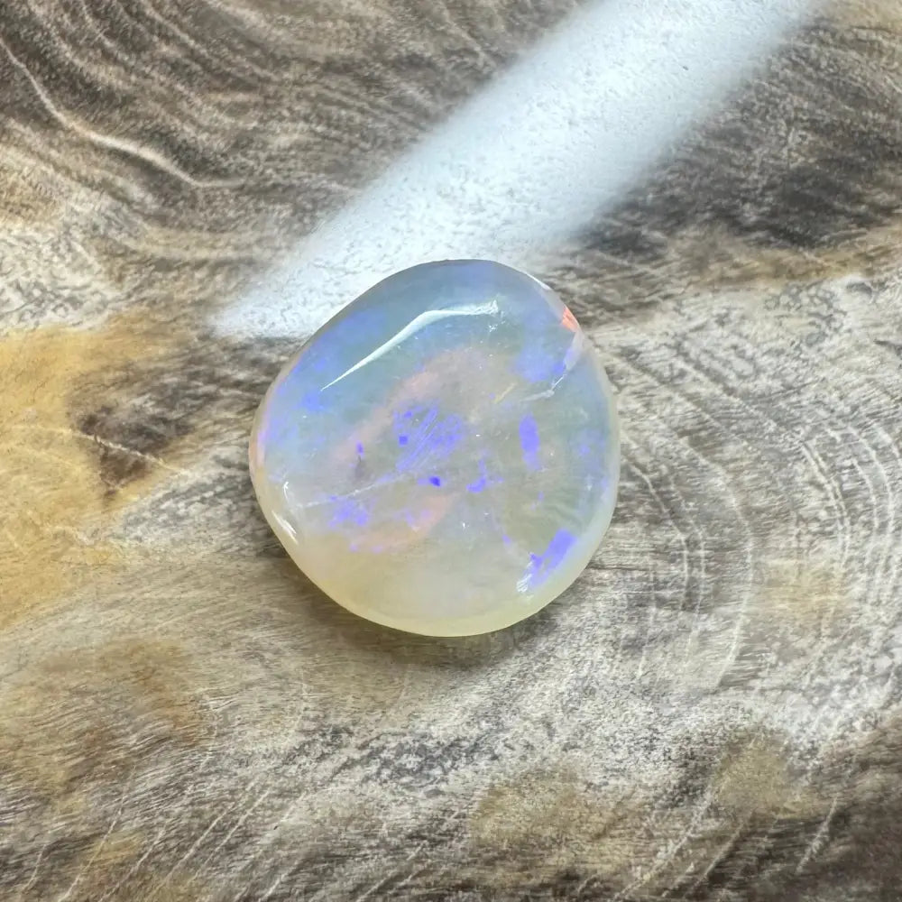Iridescent Lightning Ridge Opal gemstone in a hand-cut solid 4.7 carat setting